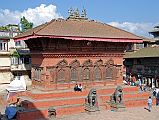 Kathmandu Durbar Square 05 02 Shiva-Parvati Temple The long low building on the northern side of main part of Kathmandu Durbar Square contains a shrine to Shiva and Parvati, who can be seen gazing down from an upper window, posing like a normal couple. The lower part of this late 1700s building is embellished for almost its whole length with a five-bayed carved wooden screen.